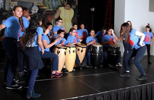 Group performing on drums